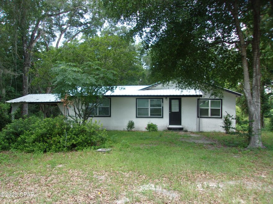 This beautifully remodeled 3-bedroom, 2-bath home in Caryville, FL, offers a fantastic blend of comfort and convenience. With a spacious master bedroom featuring a modern tile shower, it's perfect for relaxation. The new metal roof adds durability and peace of mind, while the two-car carport ensures ample parking. Strategically located with highway frontage, you're just an hour away from the stunning beaches of Panama City and the vibrant entertainment options in Dothan, Alabama. Plus, outdoor enthusiasts will appreciate being just a mile from the Choctawhatchee River boat ramp, making this property a true gem for those seeking both adventure and tranquility!
