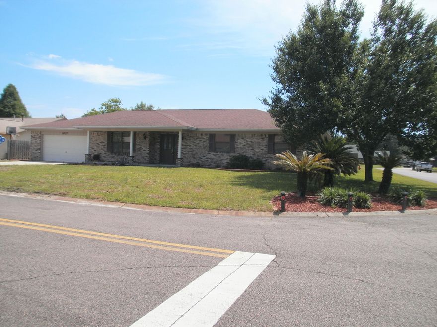 Beautifully landscaped 4 bedroom, 2 bath home on a large corner lot in the sought after neighborhood of Derby Woods. Home has tile and hardwood floors, vaulted ceilings, open living area and a brick wood-burning fireplace. The kitchen has been updated with solid oak cabinets, stainless steel appliances, granite counter tops and a walk-in pantry allows for plenty of storage space. A separate dining area is on one side of the kitchen and a laundry room is on the other side leading to a double car garage. The back yard has a covered back porch, patio and privacy fence with a double gate that can be used for parking a boat or RV.