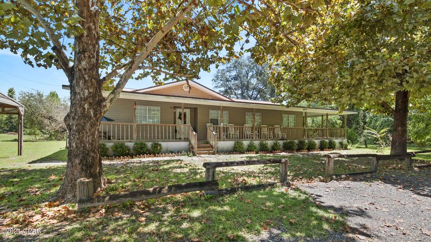 CURRENTLY UNDER CONTRACT, SELLER ACCEPTING BACKUP OFFERS' Don't wait to step inside this cozy 4/2 on 2.2 acres located in beautiful Liberty County, Florida and make it your own. Enjoy the peace of small town living, sipping your morning coffee on the rocking chair front porch, working in your yard with lemon, orange, pear, fig, grapefruit, kumquat trees and....a pond all while having the conveniences of being close to schools, grocery store, Dr.'s and pharmacy. If you love fishing or hunting this is your location. This property also has a newer roof a detached carport with storage and is within about an hour from the coast, Tallahassee, Panama City or Dothan.  Won't last long, call today to schedule your showing. All measurements are approximate, verify if important.