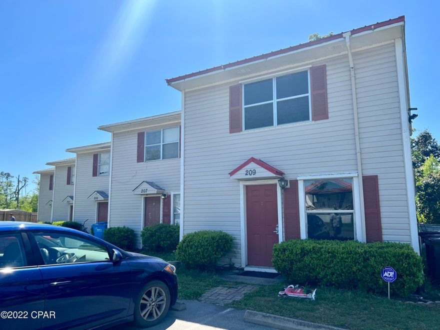 MULTIPLE OFFERS. Highest and Best, 7PM 4/18/22. Move in Ready end unit townhome that will make a perfect home or investment property. This home is just 11 minutes to Tyndall Air Force Base. The downstairs features a 12x18 living room with sliders leading to the back covered porch with an 6.5x7.5 attached storage. The kitchen and dining area are open to the living room, and there is also a laundry room and half bath, plus additional storage below the stairs. The upstairs features a master bedroom with double closets and an oversized window looking out to the backyard, and the additional room features an oversized window looking out to the front yard. Covered patio. 2019 Metal Roof. 2016 HVAC and water heater. Fully fenced yard. No HOA