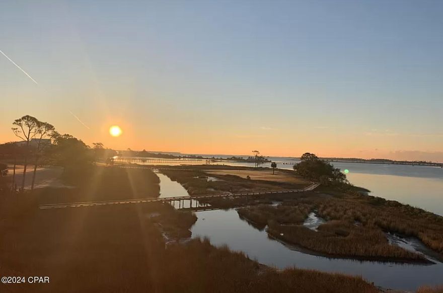 Perfect location in Lagoon Towers in the gated Bay Point Community. This condo overlooks the Bay, Pool and Golf Course. Enjoy the sunrise from your floor to ceiling windows. Spacious living and dining area open to the kitchen.  Sliding door to balcony from the living area and bedroom. Bedroom has 2 closets and a separate granite vanity with sink and dressing area. Hall bath has a single granite vanity, tub and shower combination and additional storage area. All granite countertops, stainless steel and black appliances and great cabinet and countertop space with open bar into the living area. All appliances including Refrigerator Washer and Dryer to remain.