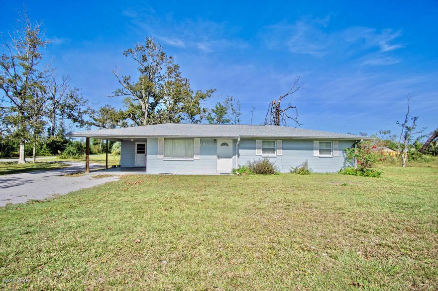PRICED TO SELL at $134,900.  Almost 1 Acre, solid block home conveniently located in the heart of Panama City. New Roof 11/2018, New Water Heater 5/2018, New AC 9/2019, New Carpet Throughout 11/2019, Electrical updated 4/2018. This home has a large feel to it with the 16.7 x 11.2 living room having more than enough room for all your furniture.  Straight ahead is the remodeled kitchen, accessible from the carport, with newer wood cabinetry, back-splash, and laminate flooring, which opens to the dining area featuring sliders to the backyard. The master bedroom has a barn slider door and its own private bath, with the other 2 bedrooms to the right of the home. This home sits on a large corner lot with +/- 1 acre of land with an  *ENTER ON MORE outside storage/workshop area.  The possibilities for this lot are endless.  There is plenty of room for a pool, playground, and so much more.  This home is ready to move into today at this price it will not last long. Very easy to show. Setup your private showing appointment today before this great deal is gone! Age, Sq.Ft., Room Dimensions, Schools, Taxes, or any important information must be verified by the buyer if important.