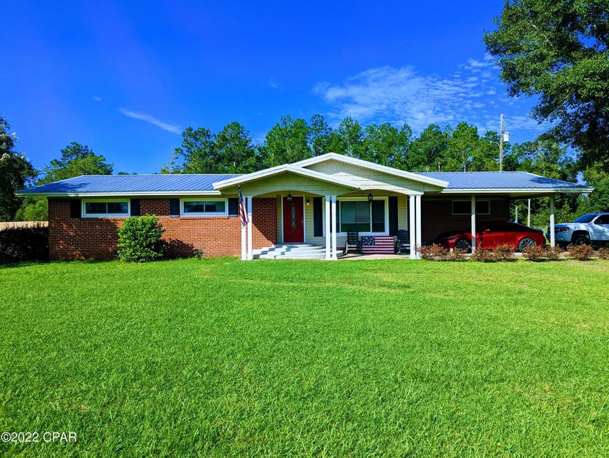 Beautiful 4 Bedroom 2 Bath Homestead on 5 Acres with Pool! This 4 Bedroom 2 Bath split floorplan home offers a roomy, yet homie feel. Upon entering through the front door, the home immediately flashes a warm and flowing semi-open style concept that moves from living room to kitchen and dining area. The Kitchen features abundant cabinetry and counter space, that wraps around to completion with a breakfast bar that is highlighted by a suspended bar rack, and overlooks the large dining area. Located off the dining area is the Master Suite. This suite features a massive Walk-In Closet and large Bathroom with Linen Closet. On the opposite end of the home, there are 3 guest rooms and a large full bath that plays host to a large, dual entryway walk-in shower. Moving outside, this property has a lot to boast about. Outside the back door, the view is that of the large inground pool, outbuilding with electric, and large pole barn. Mature trees are scattered throughout the property, and give way on the northern portion to a large pond perfect for kayaking and fishing. The property even has a ready to go chicken coop. With paved road frontage, ample acreage, and sitting just outside the city limits of Chipley, this home checks all the boxes. Schedule your showing on this property today!