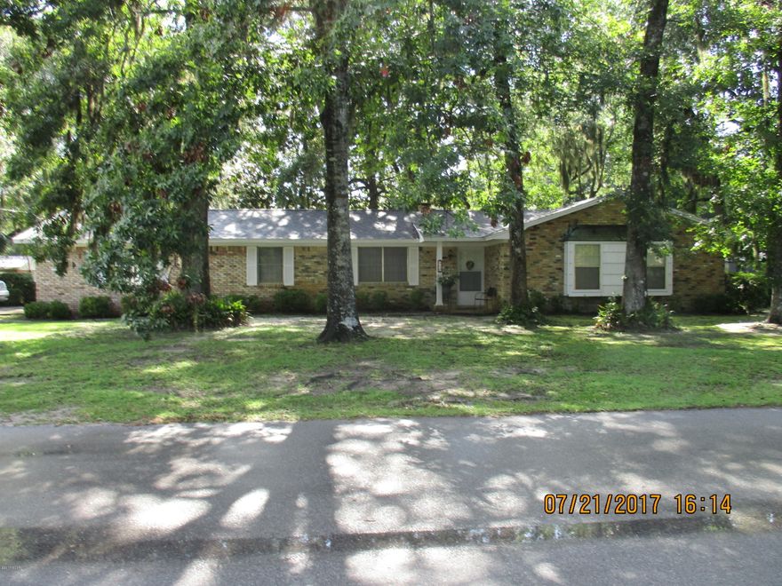 Shady Oak trees, mature landscaping, quiet neighborhood near Tyndall Air Force Base. This well maintained 3/2 brick ranch style home situated on a corner lot is just minutes to everything you would need, shopping, restaurants, banks, schools and medical clinics. You will feel at home when you enter the foyer leading to a formal living room, family room with a fireplace and hearth, dining room and a fully equipped kitchen. Continue to the Master bedroom and bath with a double sink vanity and large linen closet, two additional bedrooms with window seats. Guest bath with a double sink vanity. New carpet throughout. Seller has updated roof, heat and air, water heater, carpet and bathrooms. Beautiful backyard fenced with a double gate entry and a single side gate. Great affordable home.