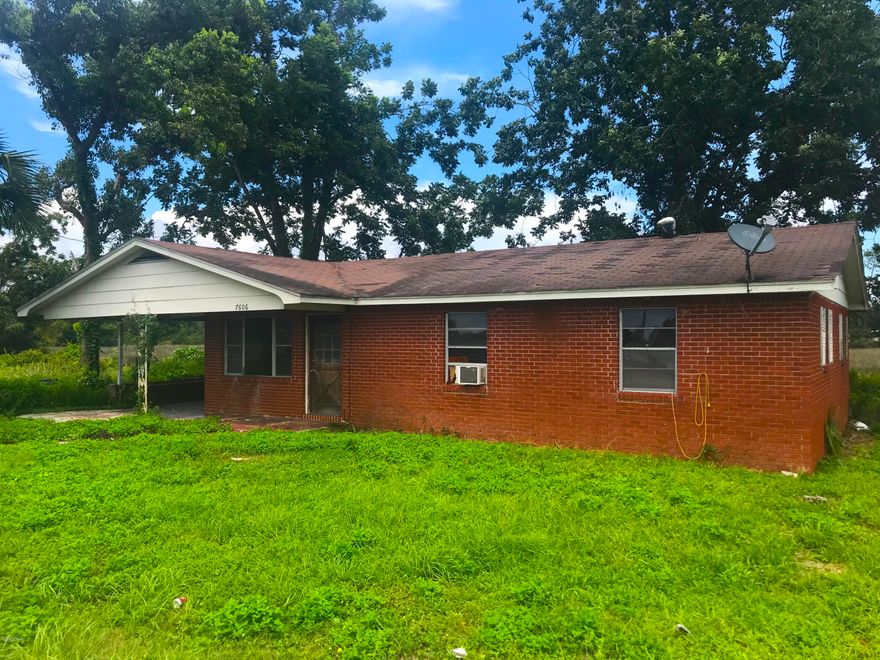 AMAZING fix & flip or investment opportunity with this brick home in Panama City! This property is a very unique opportunity - It has about 225 ft. of water / canal frontage on one side that is GULF ACCESS, and on the other side about 160 ft. of frontage on Highway 77. The property is currently zoned residential, but has the potential to be rezoned commercial / business considering the frontage on Highway 77. The home on the property is 3 Bedroom / 1 Bath with 1,000 sqft. (heated) and 1,328 sqft. (total). The home was damaged by Hurricane Michael and will require some more work (roof, drywall, etc.). At this price this home will DEFINITELY NOT LAST LONG - So act quickly! --- CASH BUYERS ONLY ---