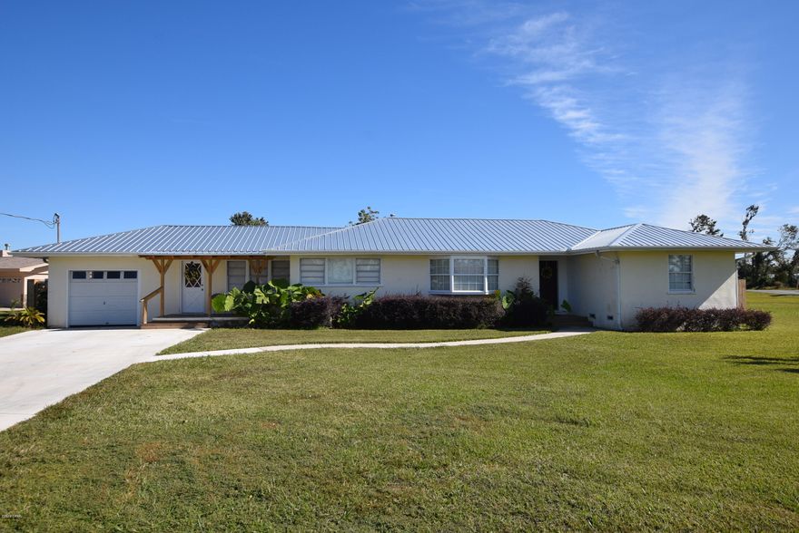 Charming 3 bedroom 2 bath home on a huge corner lot in Lynn Haven!  1/2 acre lot 2 Blocks from the bay and Kinsaul Park. Entire lot is Zone X! The home boast hardwood floors, new metal roof, and large rooms. The workshop has more than enough room for all your tools and toys. You can sit on your front porch and watch the 4th of July fireworks. Kinsaul Park features a splash pads for kids, bay frontage, and a dog play park. Homes with this much space in town are almost impossible to find so make your appointment today!