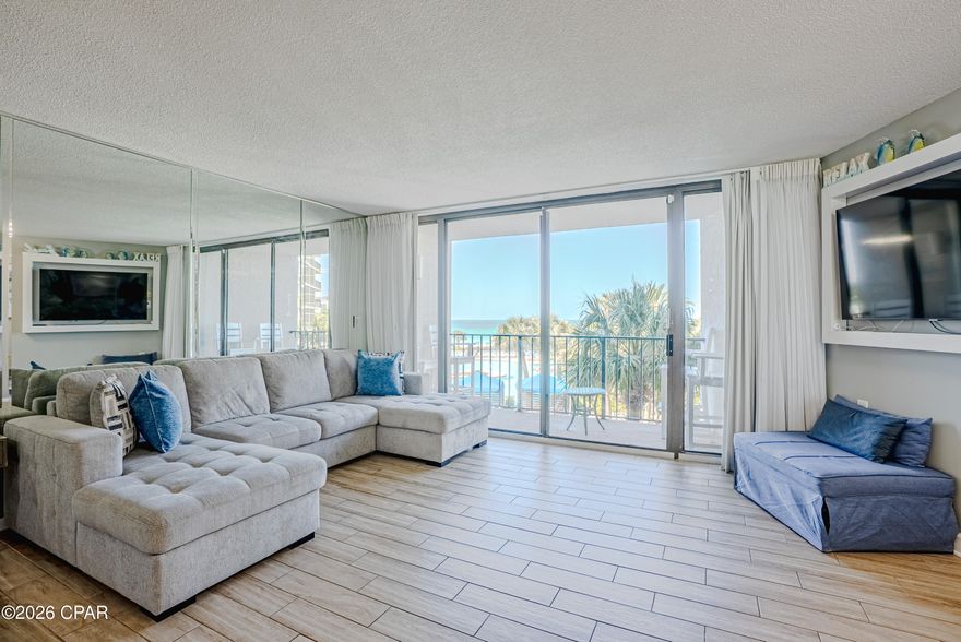 Gulf front 2 bedroom, 2 bathroom condo located in the highly sought after Tower I at Edgewater Beach and Golf Resort. Situated on the 2nd floor, this unit offers beautiful views of the lagoon style pool, tropical landscaping, and the Gulf, along with the relaxing sound of waves in the background.

Inside, tile plank flooring runs throughout, offering a clean look and easy maintenance. The kitchen features a granite breakfast bar that's perfect for quick meals, along with a separate dining nook that includes additional cabinetry for extra storage.

Both bedrooms are generously sized. The primary suite includes an ensuite bathroom with a soaking tub and shower combo. The guest bedroom has convenient access to a full bathroom, which can also be accessed from the hallway.

Updated HVAC system replaced approximately 2.5 years ago and the water heater was replaced approximately 3 years ago.

Edgewater Beach and Golf Resort is known for its impressive list of amenities including multiple pools, a fitness center, tennis and pickleball courts, a golf course, on site market, and a year round restaurant. The resort also offers direct beach access and gated parking on the same side of the street, so there's no need to deal with a parking garage.

Whether you're looking for a primary residence, second home, or investment property, this condo offers a great combination of comfort, location, and resort style living.