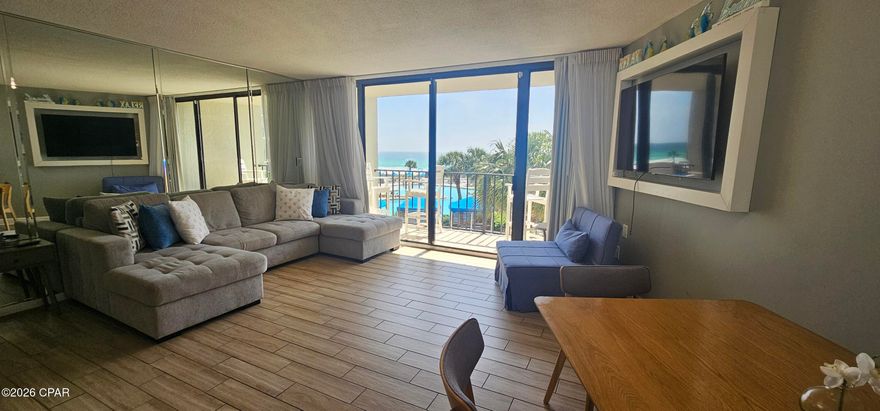 Professional Photos Coming Soon! Gulf front 2 bedroom, 2 bathroom condo located in the highly sought after Tower I at Edgewater Beach and Golf Resort. Situated on the 2nd floor, this unit offers beautiful views of the lagoon style pool, tropical landscaping, and the Gulf, along with the relaxing sound of waves in the background.

Inside, tile plank flooring runs throughout, offering a clean look and easy maintenance. The kitchen features a granite breakfast bar that's perfect for quick meals, along with a separate dining nook that includes additional cabinetry for extra storage.

Both bedrooms are generously sized. The primary suite includes an ensuite bathroom with a soaking tub and shower combo. The guest bedroom has convenient access to a full bathroom, which can also be accessed from the hallway.

Updated HVAC system replaced approximately 2.5 years ago and the water heater was replaced approximately 3 years ago.

Edgewater Beach and Golf Resort is known for its impressive list of amenities including multiple pools, a fitness center, tennis and pickleball courts, a golf course, on site market, and a year round restaurant. The resort also offers direct beach access and gated parking on the same side of the street, so there's no need to deal with a parking garage.

Whether you're looking for a primary residence, second home, or investment property, this condo offers a great combination of comfort, location, and resort style living.