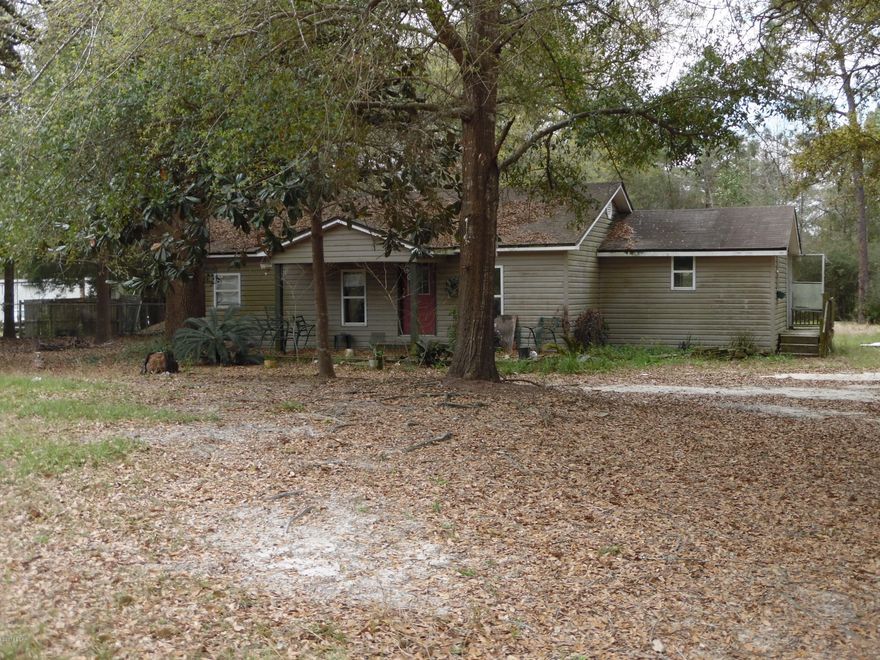 Fire Sale! First one with the cash gets it.  This 1 acre parcel was part of a bulk purchase, so the Seller says he's ready to let it go, make a cash offer and it's yours. There is well and septic on site, the lot is completely fenced, there is covered parking and a large storage shed.  Located in the most desirable designation, Flood Zone X, yet only 1/2 mile from great fishing on Deer Point Lake, this is perfect spot to build your new home, or second home.  Contact a Realtor for showing and disclosures prior to showing.