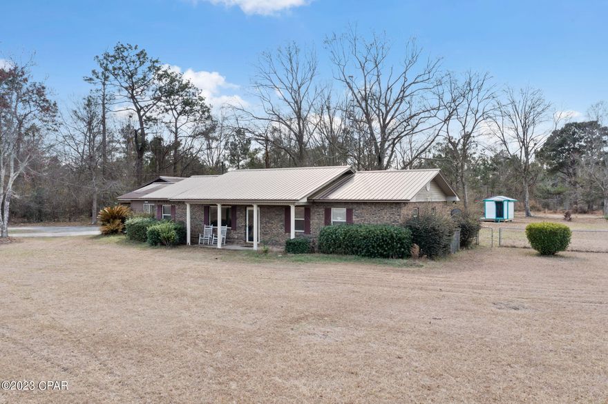 Located minutes from town this 4 bedroom, 2 bath split floor plan home is perfectly situated on 2.9 +/- acres. Inside you will find a cozy living room with electric fireplace and accent wall, eat-in kitchen with stainless steel appliances and custom tiled backsplash. Escape to the spacious primary bedroom that boast a laundry room, wall armoire units, French doors leading to the backyard and ensuite bath featuring his/her sinks, jetted tub and separate shower. Outside you will find a 24x80 metal shop with roll up doors and lean-too, stocked fishpond and fenced backyard. Home is located off Orange Hill Rd, a short drive to schools, shopping and Interstate 10.