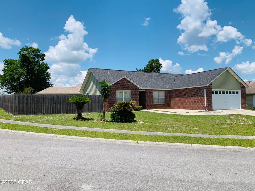 Well cared for home in the popular Shadow Bay neighborhood.  This three bedroom two bath home sits on a large corner lot with rear yard access and sidewalks.  Home has many features such as split floor plan, vaulted ceilings in living room and master bedroom, wood burning fireplace, formal dining area and breakfast nook off the kitchen.  Kitchen provides a pass through which is great for entertaining!  Brick and vinyl exterior provides easy maintenance.  Privacy fenced back yard is large enough for a pool, pole barn or shop.  Also being a corner lot, you can park your boat or RV in the back yard!  This is a great affordable home with a short drive to Tyndall Air Force Base, Eastern Ship Building, restaurants and shopping.  Only a 30-minute drive to Panama City Beach!