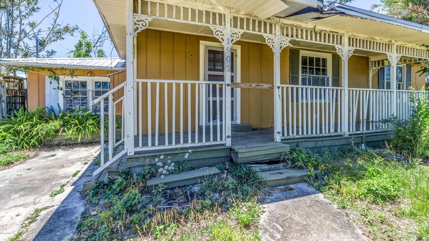 Fantastic Cove home with loads of potential and great opportunity. This home boasts an open floor plan concept with updated cabinets, fire place, hard wood flooring, ample counter top surfaces and  a space for a formal dinning room. Upstairs you will find an additional bedroom that is ready for plumbing to make this home a 3/2 note, this space is not fully finished. In the large back yard you will find a gazebo sitting area and a bamboo grove for privacy.  In the front of the home you will find a charming covered porch where you can sit and observe the bay views and cove atmosphere.