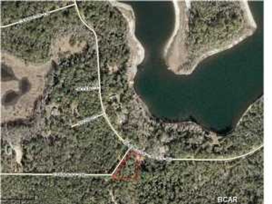Take the time to visit this beautiful neighborhood. Dunford Lake is across the street. For the fisherman and boat owners, the boat ramp is nearby. The neighborhood has paved roads and underground utilities. Beautiful wooded subdivision. A wonderful place to build your dream home. All measurements are approximate. Lot is irregular.