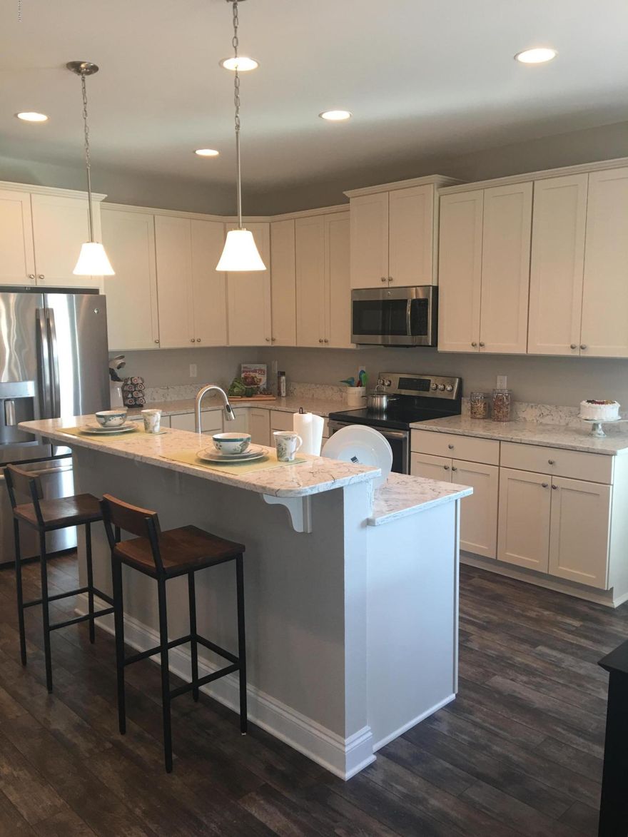 Home back on market after construction delays, move in January 2020.  Beautiful new Carley plan will have 4 bedrooms and 2 baths with large open concept common area, large covered porch and option for front covered porch. Standard features include granite counter tops, designer cabinetry and stainless steel appliances, 9-10 ft ceilings, huge master suite plus master bath has a walk in tile shower & granite counters. Mohawk Revwood Plank flooring is installed in common areas for easy maintenance.  Ceramic tile in all baths and laundry.