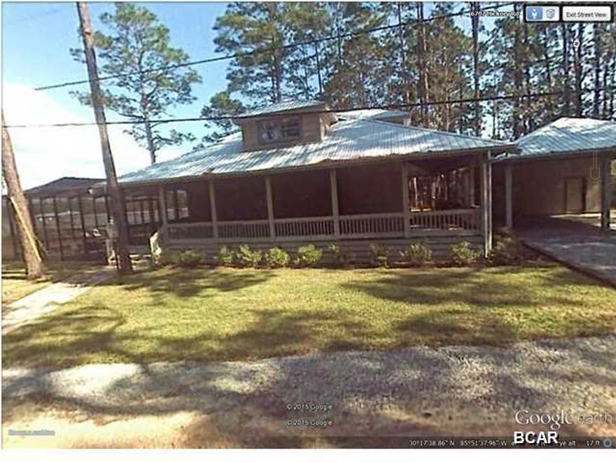 This is a must see 2,380 S.F 3 bedroom 3 bath water front home located on the intracoastal waterway with direct access to the Gulf of Mexico. Home Features 3 bedroom and 3 baths with a very comfortable open floor plan and vaulted tongue and grove knotty pine ceilings. Living room has a cozy stone gas fireplace with surround sound throughout living room, top of line appliances, ceramic tile throughout bathrooms .Bathrooms consist of separate tiled showers and bath. beautiful open beams throughout home and knotty pine floors. Walk out on the partial screened wraparound porch or enjoy the gas heated screened pool and hot tub. Automated outdoor mosquito misting systems. 8,000 pound boat lifts running water and electric . There is a covered 2 car carport that has a full bathroom that provides a extra little bonus for that outdoor life style This is water front living at its best .