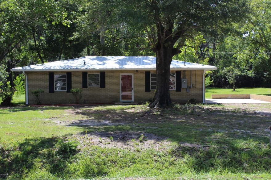 WOW, Stop the Car you gotta see this one, Fully renovated: Seller says bring offer. 10 minutes to Tyndall, close to all shopping, beaches, and boat launches, Remodeled 3 bedroom 1 bath home on 1 acre in Callaway, with public water and sewer. New metal Roof, New A/C, New Electrical, New Gutters, New Plumbing, New Paint, New Carpet, New Cabinets, New Dishwasher, New ALL IN ONE Washer/Dryer,  tankless water heater.  And all of this on 1 acre,with a covered back patio and a covered out building. All of this for 109,500. Call and make an appointment.