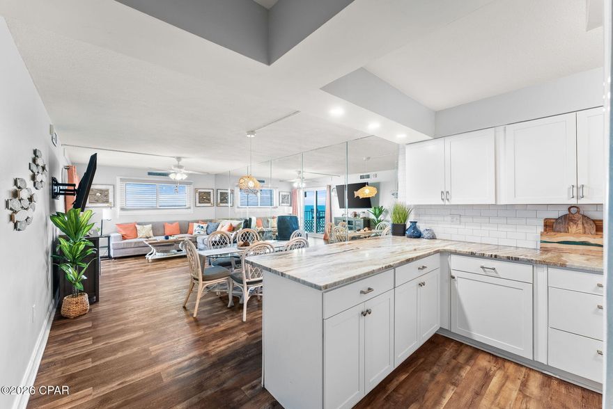 Welcome to Regency Towers on the highly desirable east end of Thomas Drive — where Gulf-front living meets panoramic coastal beauty.
This spacious 3-bedroom, 2- full bath residence comfortably accommodates up to 8-10 guests and offers breathtaking gulf views from your private balcony. What truly sets this unit apart is the stunning side view perspective — allowing you to take in miles of sugar-white sand and emerald waters stretching endlessly down the coastline. From sunrise coffee to sunset cocktails, the sweeping side views create a dramatic, postcard-worthy backdrop you simply won't want to leave.
Inside, you'll find a beautifully updated, open-concept layout featuring a renovated kitchen with granite countertops, white cabinetry, subway tile backsplash, and an oversized breakfast bar perfect for entertaining. The dining and living areas flow seamlessly, enhanced by mirrored walls that reflect natural light and maximize the gulf views. Updated flooring throughout adds a clean, coastal feel.
The gulf-front primary suite offers direct balcony access and incredible water views right from your bed. Additional bedrooms are spacious and thoughtfully designed for guests and family.
Major upgrades include completely repainted interior, AC condenser replaced (2022), new stove (2022), furniture upgrades (2023), new patio doors and windows (2024) and a new AC evaporator (2025).
Regency Towers offers one of the most impressive amenity packages in the area, including: two saltwater pools, waterslide, poolside bar/snack area, Indoor hot tub, game room with billiards, Seasonal community events, outdoor movies & poolside entertainment.
Located just minutes from St. Andrews State Park, you'll have some of the area's best outdoor recreation, boating, fishing, and nature trails right at your fingertips. Whether you're looking for a primary residence, second home, or high-performing rental investment, this Gulf-front condo delivers space, upgrades, amenities, and — most importantly — an unforgettable side coastline view that captures the true beauty of Panama City Beach. Schedule your private showing today!