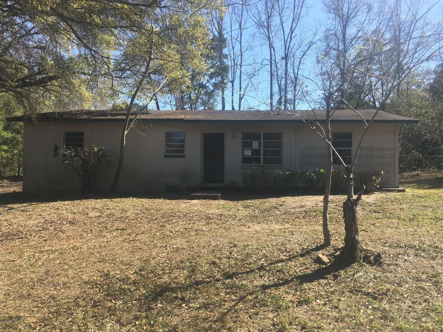 Handyman Special 3BR/2BA home nestled on over a half acre lot of beautifully wooded and private land. This fixer upper features a split bedroom floor plan, large living area, an open kitchen and has tons of potential. Do not miss out on this excellent investment opportunity! All Information recorded in the MLS is intended to be accurate but cannot be guaranteed, buyer advised to verify. Sold As-Is. No utilities will be turned on to this property and only cash/renovation loan offers with 0 day inspection period will be considered. Buyer should perform their due diligence/necessary inspections before submitting an offer.