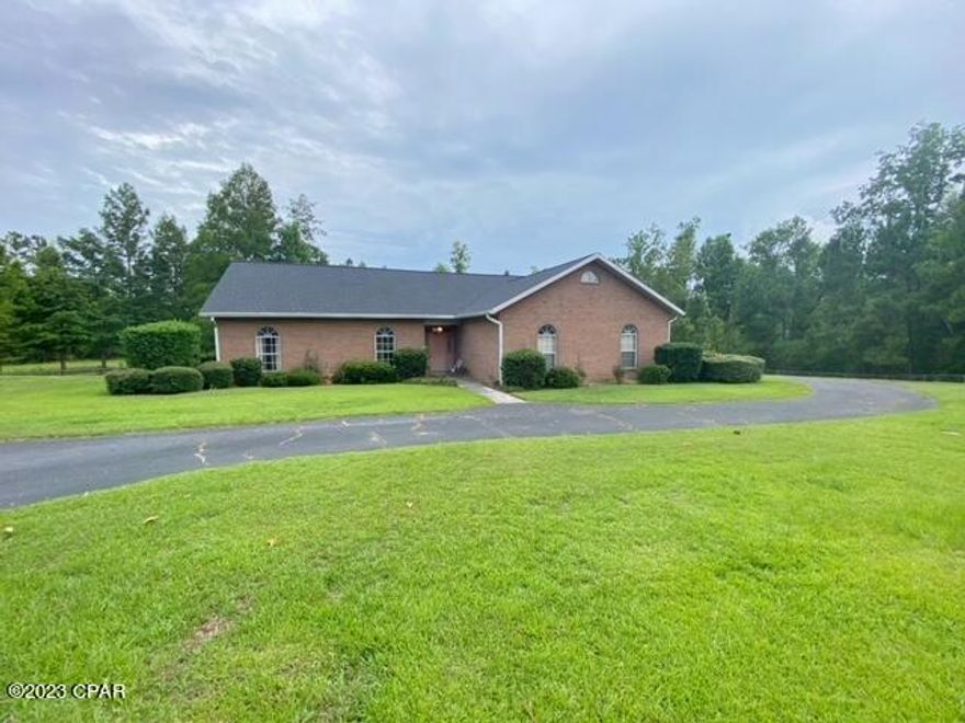 RARE FIND.... these homes with 5+ acres in Indian Springs rarely come available. Take advantage of this opportunity while you can!  This 3 bedroom, 2.5 bathrooms home has so much to offer!  You'll love the property as much as the home with a large fenced backyard overlooking the small private pond, circle drive & extra paved parking- great for entertaining, and mature trees surrounding that provide privacy.  Inside is easy living with a spacious open floorplan with central fireplace and built in bookshelves. Additional living area in the form of a generous 42 ft sunroom with screened porch nearly as large. The master suite boasts HIS and HER bathrooms each with walk in closets. Other features include: walk-in pantry/laundry area complete with half bath (shower & toilet), enclosed garage, 2 storage buildings, and newer 2019 roof. Clear more of the lot and enjoy plenty of space for kids or pets to play. Customize this home with your own paint and flooring choices, and it will be a show home once again! This property does have deed restrictions; full set of restrictions available. There is not an HOA