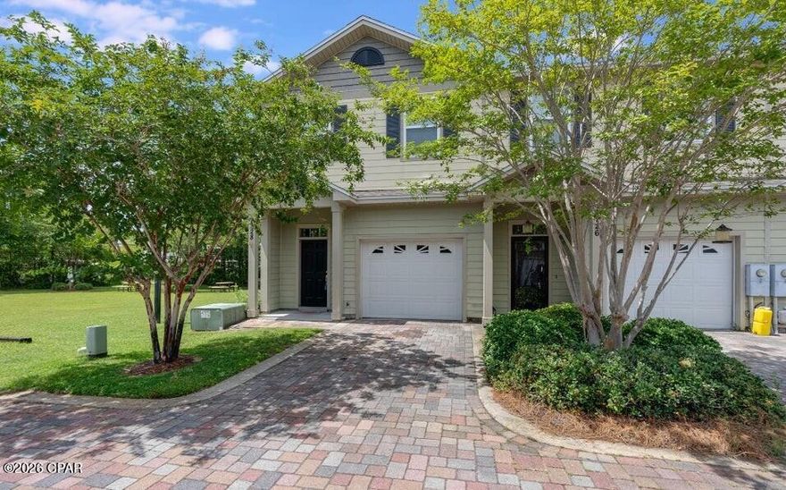 Spacious 3BR/2.5BA end-unit townhome in the desirable Quail Hollow community on the east end of Panama City Beach. This move-in-ready home features the largest floor plan in the neighborhood, an open-concept layout, and a one-car garage with private driveway. Upstairs includes a primary suite with ensuite bath, two additional bedrooms, full bath, and second-floor laundry with non-warrantied washer and dryer. Enjoy a private patio backing to green space and beside the picnic area. Community amenities include a pool and fitness center. Conveniently located near the Navy Base, Hathaway Bridge, shopping, dining, and just minutes to the beach.