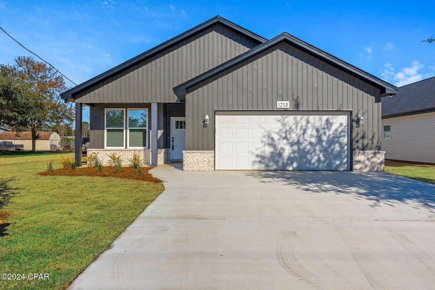 New Construction Home built by G6 Development, move in ready located in Southport, Florida!! This beautiful 4BR/2BA 1,791 SqFt house is conveniently located near schools, parks, boat launches, and only minutes away from Lynn Haven with shopping, dining, and much more. This home features many upgraded custom designer touches from the open concept floorplan with 9ft  Ceilings throughout, spacious built in desk area, decorative accent wainscoting walls and trim,  French doors with built in blinds inviting the natural light in, large open living room with tray ceiling, recessed lighting, ceiling fans, vinyl plank flooring, blinds on all windows, upgraded black fixtures and door knobs, kitchen center island/breakfast bar with gorgeous Quartz countertops perfect for serving quests, white Soft Close cabinets, stainless steel appliance package including side by side Refrigerator, large walk-in pantry,  laundry room, split bedroom floor plan, master suite boasts tray ceiling, walk-in closet, master bath includes double sink vanity with sparkling Quartz tops, linen cabinet, a fabulous walk-in custom tile shower with glass door and tile flooring. The exterior features a beautifully landscaped yard situated on 50X150 corner lot with sprinkler system, covered front porch, Vinyl Siding on all sides with front brick skirt enhancing curb appeal, double car garage, dimensional shingles with a 30-year warranty, covered back patio, septic system installed and connected to Bay County water.  Builder will provide a 1 Year Builders Warranty at closing. Verify all dimensions and information if important.