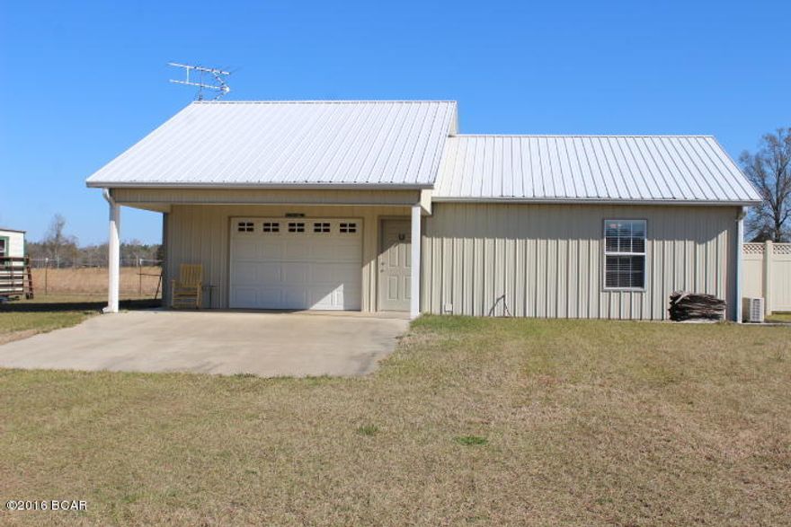 Super Nice home in the country on 9.05 Acres which borders I-10 and is fenced.

This property has a huge pole barn and a large outbuilding and is ready for cows, horses, goats or whatever.  Very nicely done with room for all the toys.