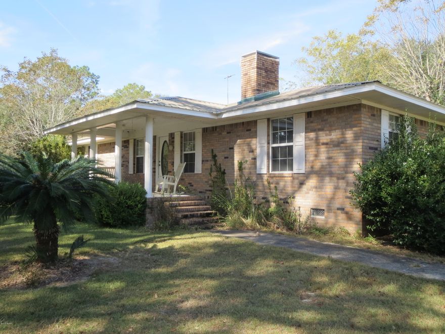 CURRENTLY UNDER CONTRACT, SELLER ACCEPTING BACKUP OFFERS. Gorgeous brick home on almost 18 acres has a screened pool house with an 18x36 in-ground pool, Florida room, screened porch, and much more! About half of the property is forested and the rest has huge live oaks, mature fruit trees and pecan trees, grapes and also has plenty of room for horses, livestock, or large vegetable gardens. Two ponds are stocked with koi, bass, and more. Enormous garage/workshop with pull-thru RV parking and dump station, pole barn, and sheds provide all the storage space you'll ever need. Includes building plans and a foundation to build a mother-in-law or guest cottage or a rental home... you could even start a family compound. You will absolutely love this little slice of paradise!