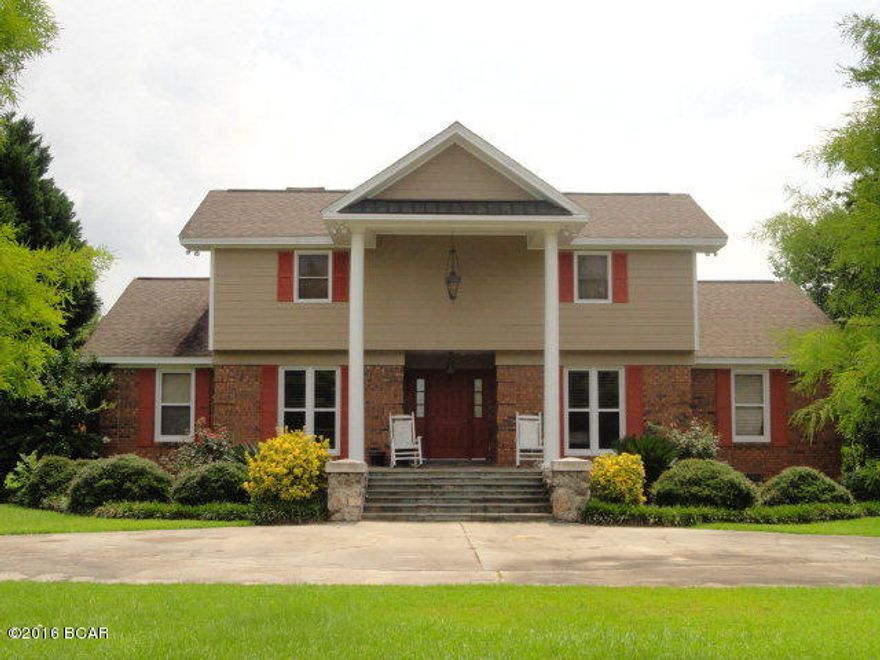 Beautiful 4 bdrm/2-1/2 bath home on 2 acres in town!  Quality is displayed throughout this home, remodeled staircase, master bedrm/bath upgrade, quality laminate flooring, new carpet in 3 bdrms and a new security system.  NEW ROOF 2016, new a/c system in 2015, all double-insulated windows and a wood burning fireplace.  Nicely landscaped yard.  Includes a 20x40 shop on a concrete floor.  You will not be disappointed!