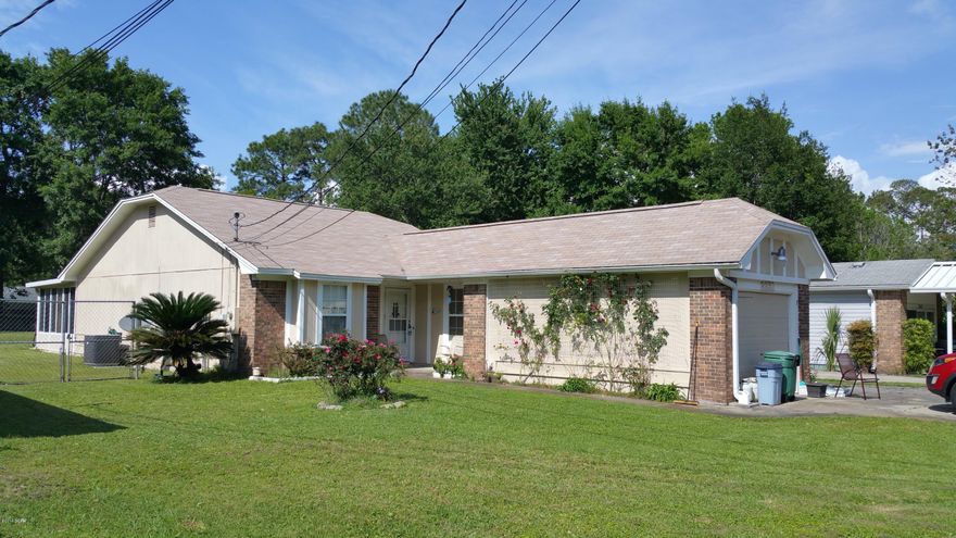 Hard to find LYNN HAVEN AREA HOME that's move in ready and AFFORDABLE! Rural Development Financing can open the door for many buyers and this home is MOVE IN READY. The large lot creates ''COUNTRY FEEL'' but you're only minutes to GREAT SCHOOLS and all the shopping in the Lynn Haven Area. Tyndall AFB and the Navy Base are both quick drives for an easy commute. This Open Floor Plan creates a spacious feel with HIGH CEILINGS. Living room, dining and kitchen areas all flowing together makes this home cozy and comfortable. The Master Bedroom is split for privacy and features a private bath. Sliding Glass Doors Open the Family Room up to heated and cooled Florida room that is not included in the sq. footage of the home. Backyard is privacy fenced, features a 19.6 X 23.6 Pole barn for extra parking with an asphalt floor, driveway and double gates for easy access.  Call for your appointment today these homes don't last long.