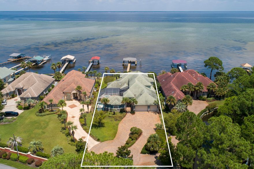 REO Real Estate Owned. One of the most beautiful Bay front residences, built with attention to detail with quality materials, workmanship, craftsmanship and a eye for detail. Enter through iron gates into a large courtyard with an 18x32 heated pool and Jacuzzi and adjoining guest quarters. The studio guest quarters comes complete with a kitchenette and sliding glass doors to the courtyard. This home has everything from the custom cabinetry and doors made from Alder wood to the many tiled terraces, surround systems throughout, plus four HVAC units and 2 Rinnai hot water systems. Even the 30x20 three-car garage is heated cooled and finished out. The 12 foot and 14 foot Triple Crown molding is throughout the home The bay front living room has 24 foot ceiling with three Ernest Hemmingway fans