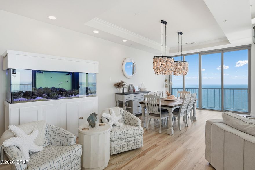 Perched atop the 15th floor of Marina Landing, this extraordinary 5-bedroom, 4.5-bath penthouse delivers a lifestyle defined by elegance, comfort, and breathtaking panoramic views. Overlooking West Bay, Grand Lagoon, North Bay, and St. Andrews Bay, the vistas stretch endlessly--captivating from sunrise to sunset and visible from every room in the home. Walk out on to the expansive 145-total feet of beautiful and serene balcony water views to catch the dolphins frolicking below. 
Inside you will find a completely remodeled home with no expense spared, this residence showcases sophisticated upgrades throughout. The chef's kitchen features premium Viking appliances, gleaming quartz countertops, under cabinet lighting and upscale fixtures and finishes that elevate both style and function. Spacious living and dining areas flow effortlessly, framed by floor-to-ceiling windows that bring the beauty of the bay indoors. All windows throughout are equipped with motorized roller blinds.
Each bedroom offers its own stunning outlook, creating a serene retreat for family and guests. 4 of the 5 bedrooms has a balcony for those relaxing moments to enjoy the weather, watching the boaters or just reading your favorite book. The spa-inspired bathrooms are beautifully updated, and the home includes exceptional storage both inside and out--an invaluable luxury in penthouse living.
Additional highlights include two prime parking spaces and access to Marina Landing's impressive amenities: a well-equipped gym, meeting room, inviting lobby, and a sparkling pool and spa. Ideally located near downtown, top-rated restaurants, and the world-famous beaches of Panama City Beach, this penthouse blends convenience with coastal sophistication.
A rare offering of quality, scale, and design--this is truly a must-see.