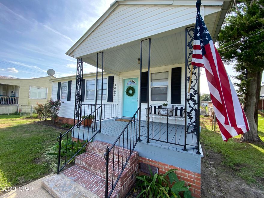 CURRENTLY UNDER CONTRACT, SELLER ACCEPTING BACKUP OFFERS- Cute little 3 bedroom, 1 1/2 bath Florida Cottage in downtown Marianna! This home features wood look vinyl flooring, wood cabinets, a covered front porch, a large open back deck, and fenced in back yard. There is a tiled full bathroom with shower/tub combo and updated vanity, and a half bathroom. This home is located in close proximity to Jackson Hospital, Chipola College, and downtown Marianna. It is also a short drive from Marianna K-8 and MHS.