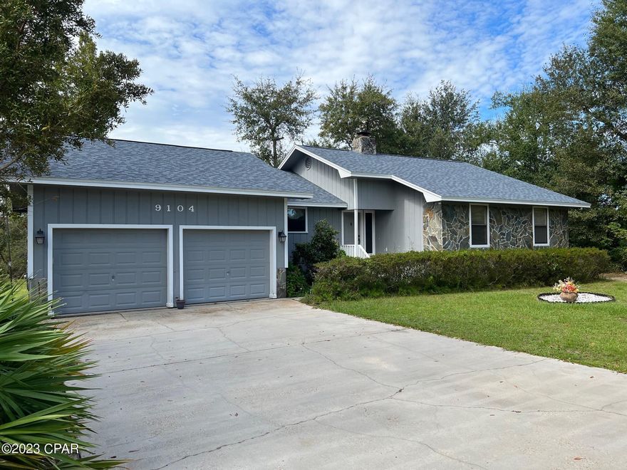 Quiet country living near town can be yours on this beautiful 3 acre setting in the Bear Creek neighborhood. This one owner, 3 bedroom/2 bath home has had a new roof in 2019, new hot water heater in 2019, and new AC in 2017 (cage new in 2019). It was built high on a solid concrete slab which allows for stress free living even though the back of the lot is in a flood zone. The cathedral ceiling in the living room gives it a spacious feel, capped off with a stone fireplace. The living room is open to the dining area and spacious kitchen with ample cupboards and a breakfast bar. All three bedrooms are spacious with large closet storage. The primary bedroom has a private bath. Take a break and relax, either on the screened in porch or on the deck overlooking this private property. An artesian well with an added filtration system provides the home with it's water. Bear Creek defines the back edge of the property. Included on the land is a small barn and a pond.