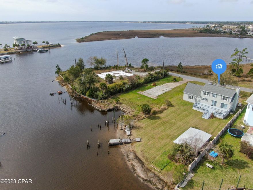 Waterfront home with deep water access and bay  views for an excellent price! This 3 bed 2 bath charmer has been well kept and offers an oversized lot with a private setting on a dead end road. The back yard fronts a canal that leads to east bay with a large attached deck for viewing enjoyment. Home also features an attached 2 car garage, new roof after Hurricane Michael and more. Don't wait!