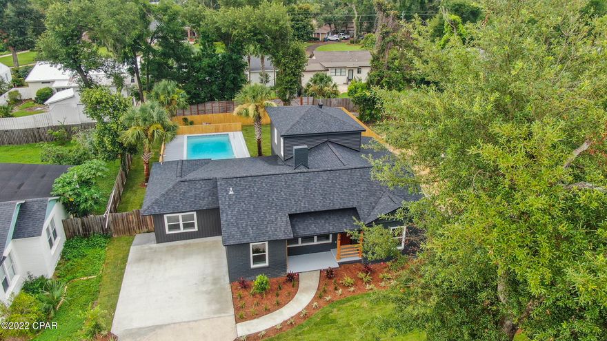 CURRENTLY UNDER CONTRACT, SELLER WILL CONSIDER BACKUP OFFERS - CLASSIC COVE CHARMER WITH AN IN-GROUND POOL! The interior of this sophisticated home features 4 bedrooms, 2 1/2 baths, a semi-open floor plan with split bedrooms, an upstairs bedroom with a balcony overlooking the backyard and pool, 2 living rooms + a bonus flex space (great for an office or home school room), a brand new kitchen, new vinyl plank and tile flooring throughout (no carpet), and 2 washer/dryer hookups. The kitchen boasts new cabinets with soft close drawers and doors, a breakfast bar, new quartz counter tops, new stainless steel appliances and a pantry. The master bedroom is large and has an adjoining master bath with an elegant black tile floor, a walk-in tiled shower, a luxurious claw foot tub, a double sink vanity, and a huge walk-in closet with washer/dryer hook-ups and a huge walk-in closet with washer/dryer hook-ups (very convenient). The exterior features a large fenced backyard with back alley access, a sizable patio (great for parties and BBQs), an in-ground pool with trex decking, attractive landscaping, and a covered front porch. UPDATES: Roof, 2 HVACs (1 brand new and 1 new-ish), 2 Water Heaters (1 tankless), Siding, Windows, Flooring, Fixtures, Kitchen, Baths, Spray Foam Insulation, Electrical, Plumbing, Sprinkler System and more.  This isn't your average Cove home!  Call today for a private preview.