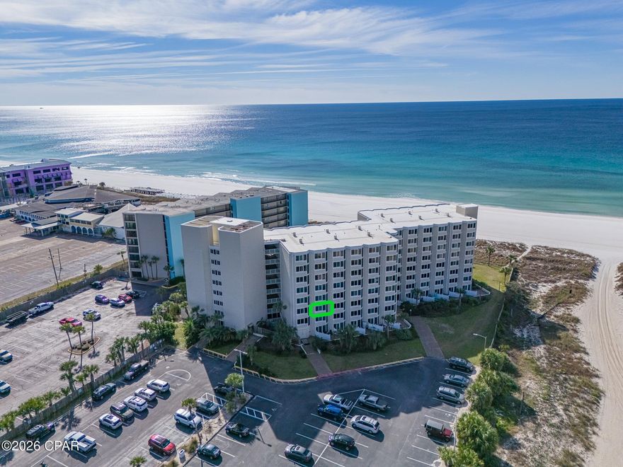 This desirable low-floor unit offers the perfect beach hideaway on the sugar-white sands of Panama City Beach. Well maintained and thoughtfully furnished, the condo is truly turnkey and ready for immediate enjoyment. Whether you're seeking a short-term rental opportunity or a second home by the beach, this unit fits the bill.

Conveniently located in the Thomas Drive area, you're just minutes from shopping, dining, entertainment, and all that Panama City Beach has to offer. The community provides direct beach access along with a pool just steps away—ideal for owners and guests alike.

Top of the Gulf amenities include a beachfront pool, tiki bar, shuffleboard, fitness center, game room, and expansive sun decks. With its strong rental appeal and prime location, this unit presents an excellent investment opportunity. All measurements are approximate and should be verified if important.