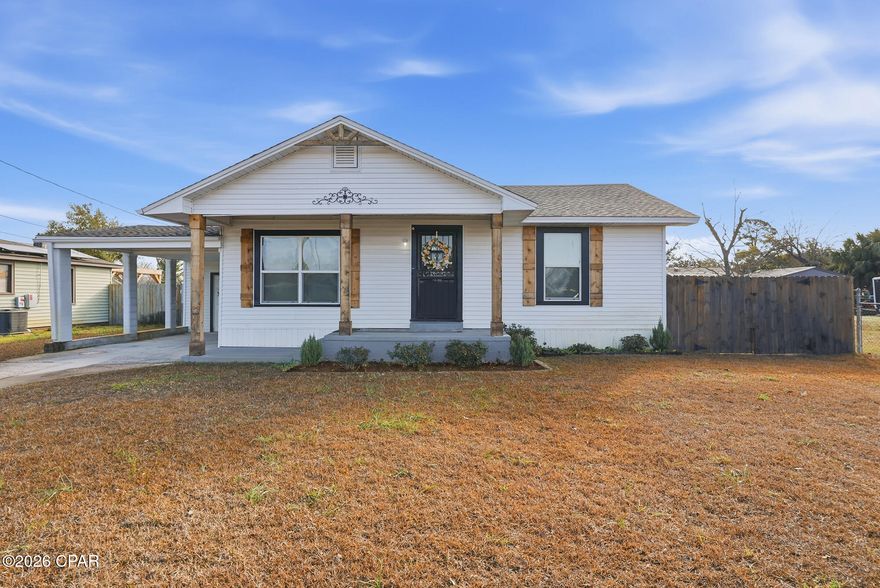 Beautifully renovated 3BR/2.5BA home just minutes from St. Andrews Bay! This home has been completely updated from top to bottom, including a newer roof, HVAC, windows, water heater, cabinetry, backsplash, drywall, lighting, fully remodeled kitchen with stainless steel appliances, full remodeled bathrooms, plus updated plumbing to the street and updated electrical throughout.

The split-bedroom floor plan offers both privacy and functionality. The spacious kitchen features abundant cabinet space and a large pantry, perfect for everyday living or entertaining. Mostly original hardwood floors throughout add warmth and character. Generous closets and storage provide plenty of room to stay organized.

Situated on a large lot, with a privacy fenced in back yard, the property also includes four storage buildings, highlighted by a newly constructed, professionally built 12x24 structure with excellent potential to be converted into a guest suite, workshop, or income-producing tiny home (buyer to verify zoning and use). A well-fed irrigation system keeps the lawn lush and green in warmer months, and a sizable carport provides convenient covered parking.

Ideally located near shopping, dining, and waterfront attractions. All appliances convey, making this home truly move-in ready. Don't miss this opportunity--schedule your private showing today!