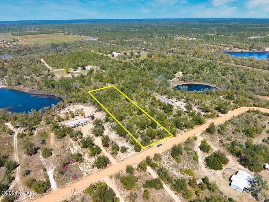 Pristine and undeveloped 2.5-acre property on Silver Lake Rd ready for your home or rural retreat. Zoned Residential - you can have two homes on this property (one per acre). Mobile homes also permitted! This property is only 35 minutes from Panama City, incredible Gulf Coast adventures, and memories to last a lifetime! Small northwest corner of the property is in a flood zone A. Outlines in aerial photos are approximate. Buyer should verify all details.
