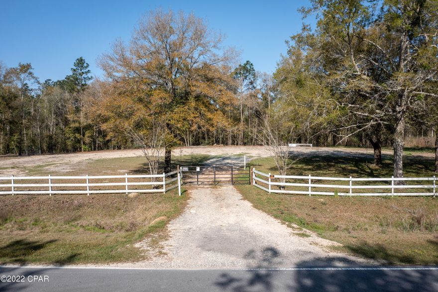 CURRENTLY UNDER CONTRACT - SELLER ACCEPTING BACK-UP OFFERS! Beautiful homesite with acreage waiting for your new mobile or site built home!  You will be immediately drawn to the white fence and the beautiful oak trees that welcome you to make this property your future homesite.  This property has been cleared, has a well with a new galvanized tank and a power pole already installed. Located halfway between the Choctawhatchee River and Holmes Creek, it is the perfect place for the avid fisherman.  Additionally, it is only about 25 minutes to the world's most beautiful beaches.   Don't delay, contact your favorite realtor today!