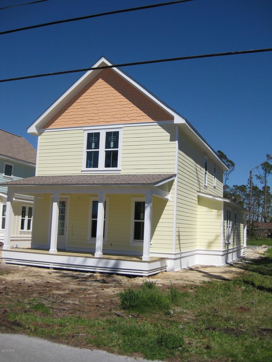 Purchase now and have input on floor covering and colors! This new home is close to the navy base, schools, restaurants and all the Panama City Beach attractions. It is unique in that it faces North Lagoon and Poinciana Dr, both of which are paved. You can enter the garage from the rear of the home and park in the front of the house . Looking to stay in shape? There is a county maintained walking/jogging path on the front side of the home which goes the length of North Lagoon Drive. The home features 9' ceilings, 2 large covered porches, 2 Central A/C units for better comfort and savings, and a jetted bathtub in the master bathroom. and ample storage space. Measurements approximate. Verify if important. Listing agent has equitable interest in property.