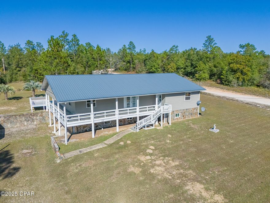 🏠 Beautifully Remodeled 6 Bedroom, 3 Bath Home — 4,050 SF of Pure Florida Living!

This expansive 6-bedroom, 3-bath, 2-story home offers an impressive 4,050 sq ft of completely remodeled living space. Every detail has been thoughtfully updated to create a fresh, modern feel throughout. Enjoy peace of mind with:

New sheetrock throughout

New LVP flooring

Marble countertops

All-new stainless steel appliances

Sleek, updated fixtures and finishes 

Tons of storage

Can sleep multiple families with another living space or game room on 2nd floor

Step outside to your multi-level covered decks, ideal for relaxing or entertaining. The expansive back deck features its very own tiki bar, offering the perfect space for gatherings, cookouts, and unforgettable evenings under the Florida sky.

🌳 Space, Privacy & Endless Possibilities
Set on over 2.25 acres, this property provides room to breathe and space to create the lifestyle you want. Host large family reunions, build outdoor amenities, or simply enjoy the peaceful privacy of your own country retreat.

As part of the Compass Lake community and HOA, homeowners enjoy access to:

Large Pristine lake

Excellent fishing

Swimming areas

Boating

Nature trails and outdoor recreation

🌿 Adventure Just Minutes Away
Only 15 minutes from the historic Marianna Caverns, you'll discover underground wonders, scenic hiking, and unique geological formations. Nearby, crystal-clear springs offer perfect conditions for kayaking, swimming, paddleboarding, and cooling off in the fresh spring water.

Just 15 minutes away, the town of Marianna puts everything at your fingertips—dining, shopping, groceries, and everyday conveniences.

☀️ Just 45 minutes from The World's Most beautiful Beaches on Panama City Beach and turquoise waters and sugar white sands of the beautiful Gulf of America!

Incredible shopping

Top rated dining; including Captain Anderson's Seafood Restaurant as featured in Southern Living Magazine

Event venues and recreation facilities

Annual festivals like the iconic Gulf Coast Jam

Top Golf!

Sports tournaments and family fun such as go cart tracks galore, mini golf, Dolly Parton's Pirate Voyage Dinner Theatre are just a few!

Continue 20 minutes west of Panama City Beach and arrive in the prestigious 30A / South Walton area—home to world-class fishing, beaches, upscale shops, and charming coastal towns.

📞 Don't Miss This Rare Gem!
A property of this size, condition, and prime location is truly hard to find. Call today to schedule your private tour and experience the beauty and lifestyle this exceptional home has to offer!