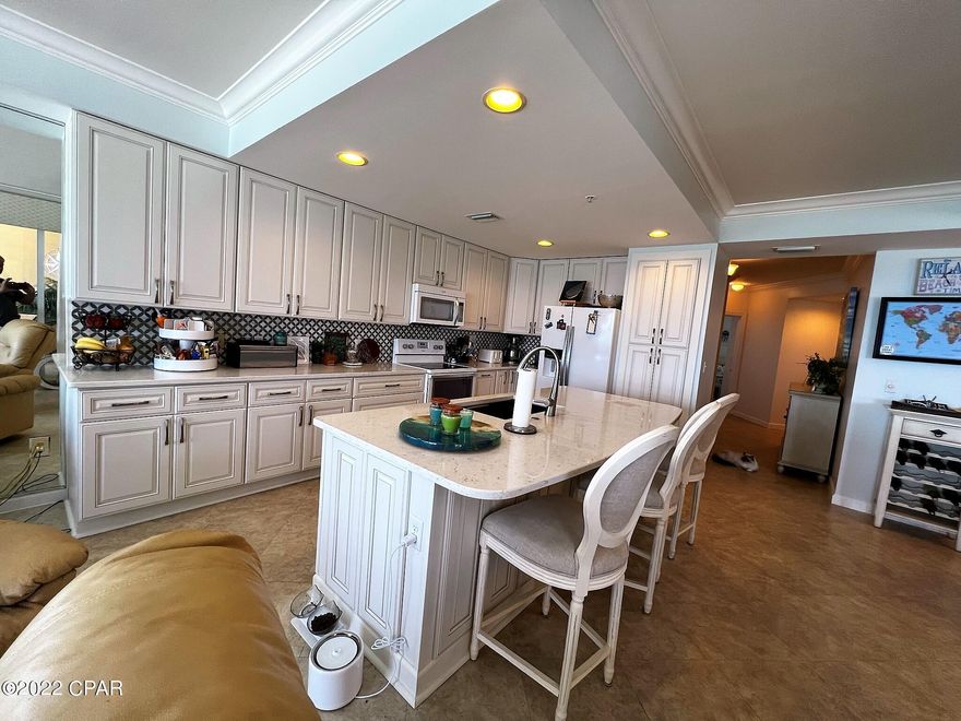 (** Seller is giving a $100,000 decorator, furniture & Flooring allowance at list price. **) En Soleil known as the Ritz Carlton of Panama City Beach. This unit has one of the best Gulf Views in the complex. This exclusive resort features only three residences per floor. The double door entry leads you to an exceptional Gulf-Front space with a generous floor plan and endless beach views. All new kitchen in Oct 2020.  The private 500+SF balcony features a summer kitchen, dining and plenty of room to relax in the sun. There are 2 master suites, guest bedroom, bunk room, cozy fireplace, full size laundry room, owner's closet. Also included is a designated parking space #50 under the building! Vacant & unfurnished. Also has a large storage room. Low density. On site security. Vacation rental