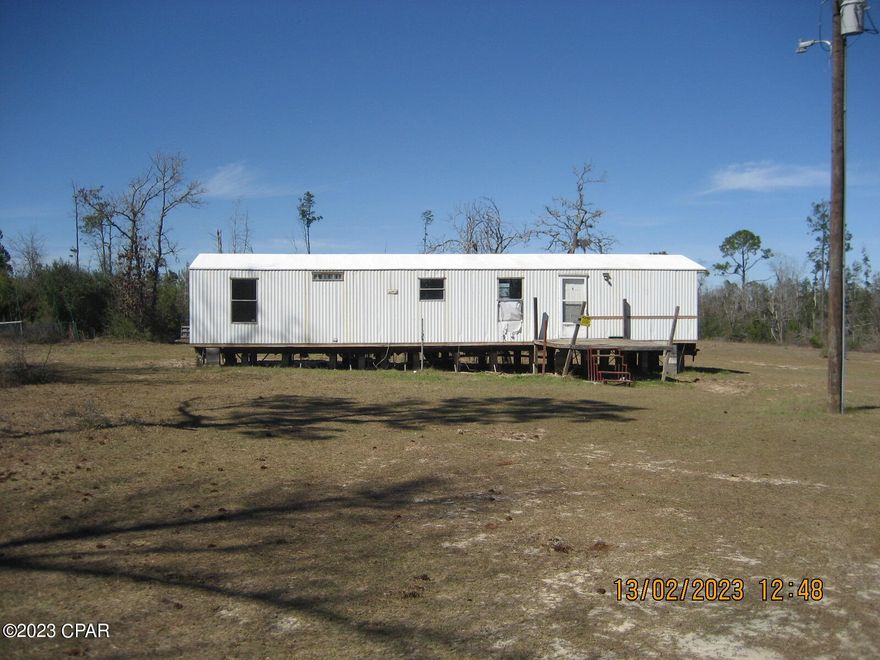 Beautifully secluded 10 square acres that is waterfront on Bear Creek.   This property is secluded yet close to Highway 231.  The property is open grassland around the mobile home and wooded along the creek.     Fountain Recreation Park is right next door.  The mobile home needs work.   OWNER WILL FINANCE WITH 10% DOWN.  6.5% for 30 years.  Payment of $878.89.  All information is deemed approximate and should be verified by buyer, if important.