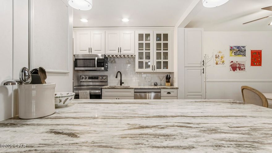 Experience coastal living at it's finest in this beautifully updated condo on the bay located in one of Panama City's most desirable waterfront communities. Unit S-102 offers the perfect blend of comfort and style. Step outside for breathtaking views of St Andrews Bay. 

Step inside to discover a bright open concept  living space with large windows that fill the home with natural light. The modern kitchen features stainless steal appliances, sleek countertops and ample cabinet space , making it both functional and elegant. 

Enjoy spacious bedrooms and premium finishes throughout that create a fresh and inviting coastal feel. The living room opens to a patio, ideal for relaxing and enjoying the fresh air. The primary suite is a private retreat featuring a remodeled master bath with elegant, modern updates - including a beautifully tiled shower, upgraded fixtures, and a contemporary vanity that adds a touch of spa-like luxury. 

Community features include * Clubhouse  * Covered  Pavilion and picnic / grilling area  * Dock * Private Beach * Fitness Room -

Located just minutes from Historic St. Andrews, dining, shopping, and the best of Panama City's waterfront charm, this condo offers both tranquility and convenience. The water heater has recently been replaced and a $1200 special assessment has been paid as well.