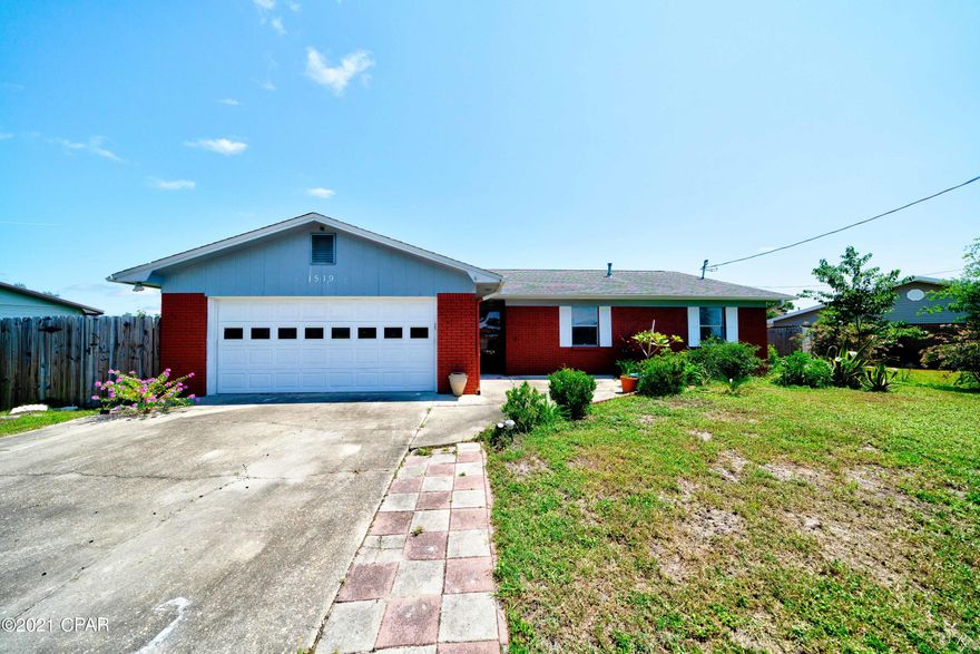 This beautiful 3 bed, 2 bath brick home is located in a quiet neighborhood in the desired Bay Front community. The large and open living area features hardwood floors, a brick fireplace, and vaulted ceilings. The eat-in kitchen boasts a Bay window, stainless steel appliances, granite countertops, plenty of beautiful cabinet space for storage and tile flooring with a formal dining area. The master bedroom is equipped with hardwood flooring throughout, a walk-in closet and its own private ensuite.  The master bathroom boasts a tile surround shower/tub combo, tile flooring, and an updated vanity. The two guest bedrooms share a bathroom equipped with a tile surround shower/tub combo and white tile flooring. The home features an open sunroom with plenty of natural light to enjoy day or night. This home has a large patio with a fenced in backyard perfect for enjoying the Florida sunshine with family. This home is located near restaurants, schools, and grocery stores for your convenience. Check it out today!