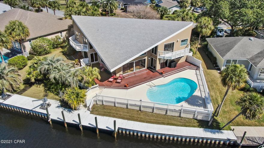 CURRENTLY UNDER CONTRACT, SELLER ACCEPTING BACK UP OFFERS!

This spacious, open contemporary style canal home is situated perfectly on a beautiful  lot with magnificent  water views from every room.  This 4 bedroom 3.5 bath home comes with a 120' dock including a boat lift and newly rebuilt sea wall.  There is enough dock space for large boat plus jet skis

With a spacious open floor plan, comfortable layout, and up to 20 foot vaulted ceilings in the living room this house is sure to impress.  Master bedroom is large with great views down either side of the canal.   Master bath has jetted soaking tub with separate shower and dual vanities.  The back of the house has a large deck with lots of night lights, great for entertaining, that leads to the pool overlooking the canal.

New roof in 20 Seller will consider owner financing.  Please call listing agent to discuss details.