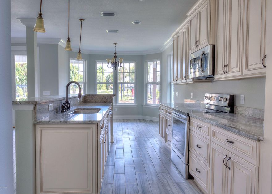 Another beautiful home by Alpha First Construction, Inc is built with custom touches and attention to detail. Contemporary open floor plan. Granite countertops, upgraded stainless steel appliance package and soft close cabinets. Master Bath features a double vanity, contemporary shower and walk-in closet. Master suite and Living room feature tray ceilings. Modern ''Wood look'' tile throughout entire home and Smart style frieze carpet is placed in bedrooms. Low E-Energy saving window package.

Upgraded lighting package. Attic Insulation rating R-38, walls R13 for your energy savings. A Must See! Age, SF lot and room sizes are approximate. Please verify if important