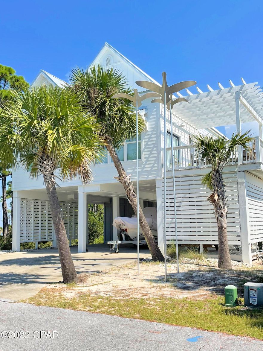 Fabulous house on CSB. Lovely 3 bedrooms and 3 baths house with beautiful natural lighting and large open spaces. The main level offers a lovely living area with a fireplace, kitchen, and magnificent island for entertaining, Dining area has a high ceiling and beautiful natural lighting. The elevator opens into this area. Also, there are two bedrooms and two baths bath, laundry area on this level. Upstairs is the master bedroom and bath and a separate living area. There are two outdoor setting areas. Great parking under the house,(very high so you can also park your boat.) Incredible storage area to park your golf cart and other toys! The surfside community offers beach access with a community boardwalk.