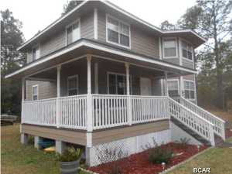 This beautiful home is tucked away in a gorgeous area near Deerpoint Lake! Owners have recently painted the exterior including the porch. The floors have all been updated. The floor plan of this home has always been desirable. Nice staircase just inside the foyer area and to the left is a large combination dining room and living room area. To the right is another living area that could be used as a den, formal dining room, gameroom, or many uses as a bonus room. The kitchen is in the back of house overlooking back yard, very clean and neat and has a pantry. It is rare to find a home with this much open great room space. If one desires a downstairs bedroom the area to the right of the stairway could possibly be converted to a fourth bedroom accessing the bathroom in back of it. This