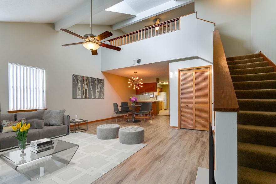 This centrally located 2 bed/2 bath townhouse features large bedrooms, upstairs loft, vinyl wood floors, and fenced in backyard. The updated master bathroom includes a subway tile shower. The roof, water heater, and A/C unit are all under three years old.